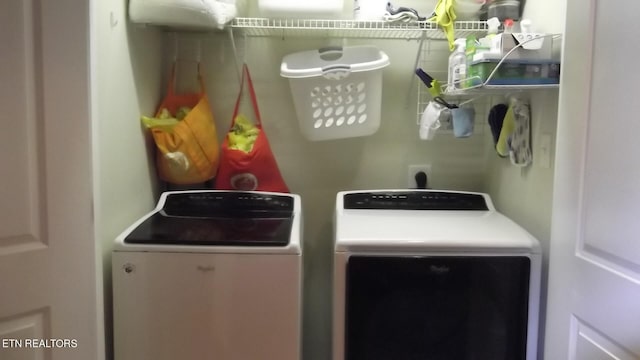 washroom with separate washer and dryer