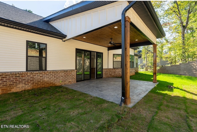 view of patio with ceiling fan and fence