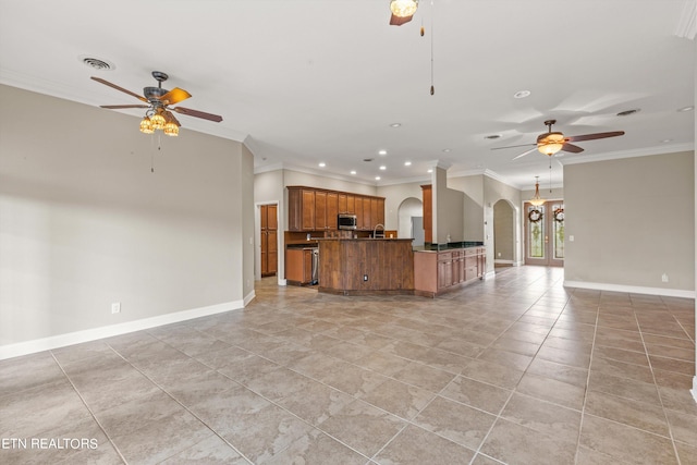 kitchen with ceiling fan and crown molding