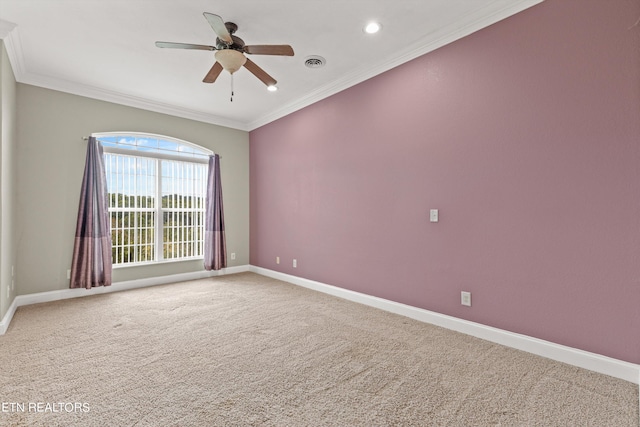 carpeted empty room with ornamental molding and ceiling fan