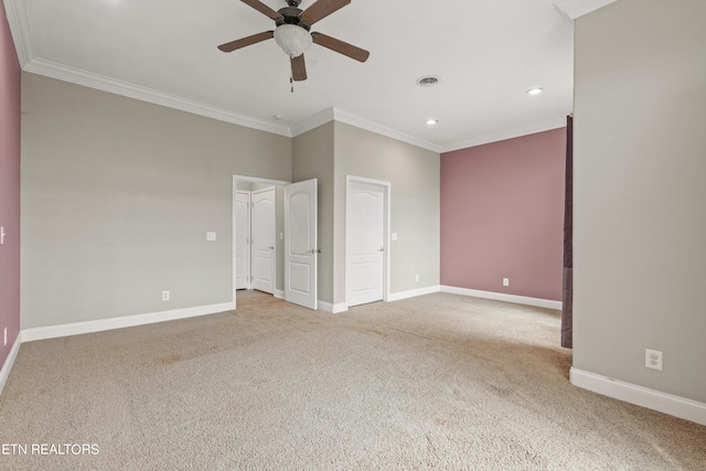 unfurnished bedroom featuring light carpet, ceiling fan, and crown molding