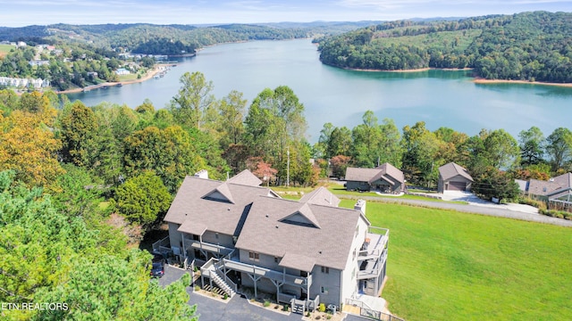 birds eye view of property with a water view