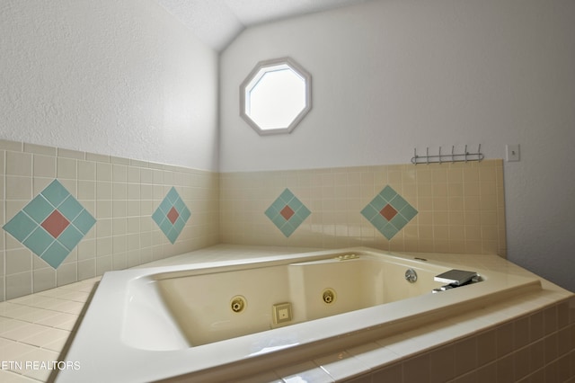 bathroom featuring tiled tub