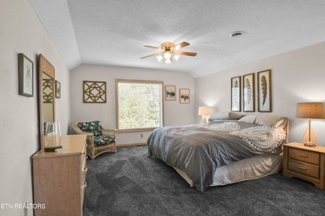 bedroom featuring vaulted ceiling, ceiling fan, and carpet flooring