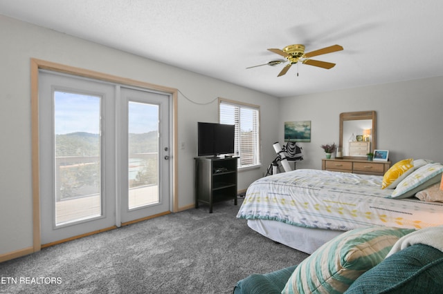 carpeted bedroom with a textured ceiling, ceiling fan, and access to exterior