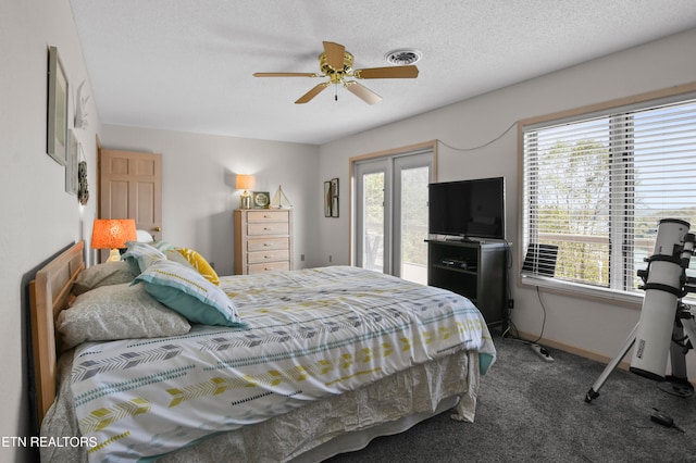 carpeted bedroom with ceiling fan, a textured ceiling, and access to exterior