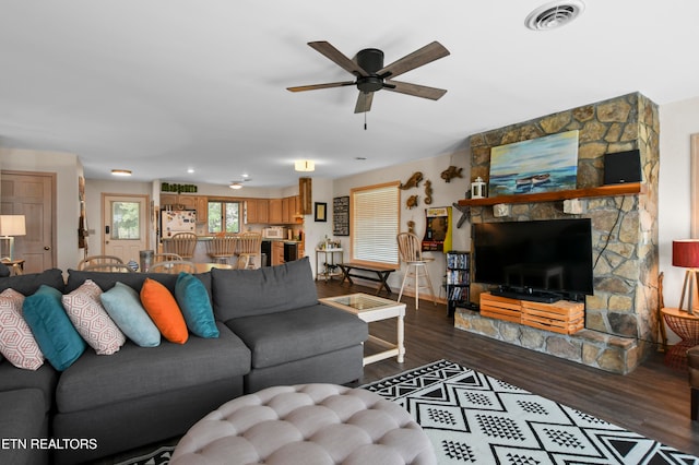 living room with ceiling fan and hardwood / wood-style floors