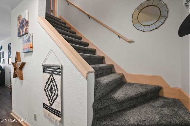 stairway featuring hardwood / wood-style flooring