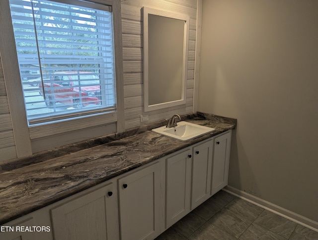 bathroom featuring tile patterned flooring and vanity