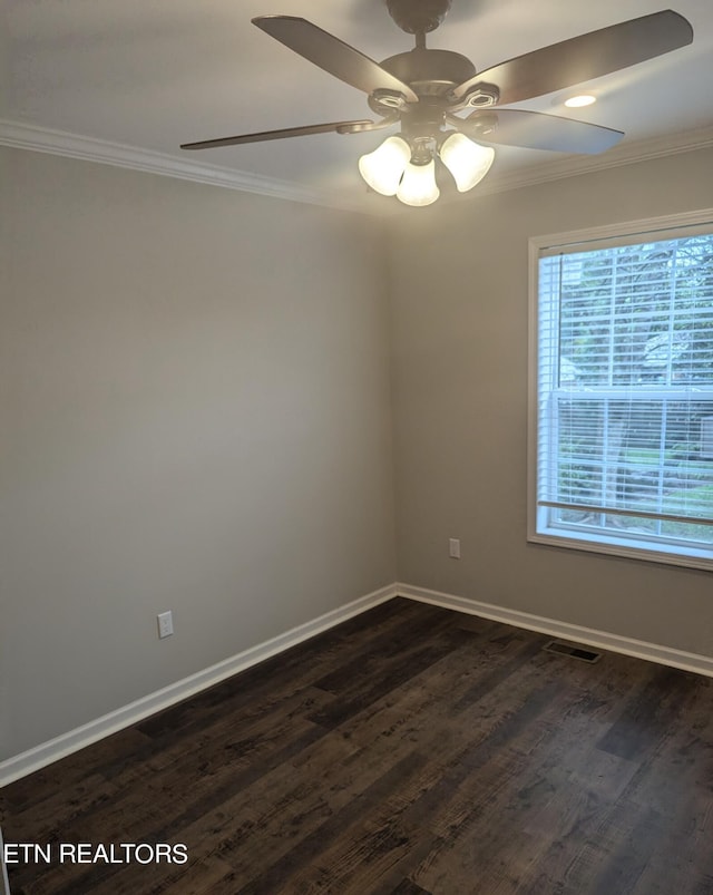 unfurnished room with ceiling fan, dark hardwood / wood-style floors, and crown molding