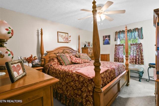 bedroom with light carpet, a textured ceiling, and ceiling fan