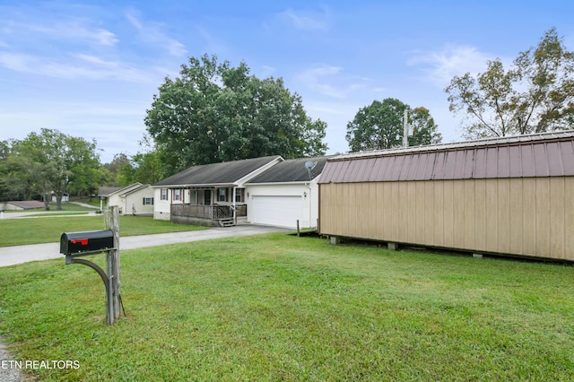 view of front of home featuring a garage and a front lawn