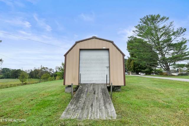 view of outdoor structure featuring a yard