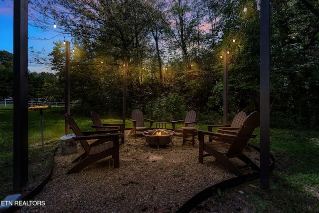 view of yard with an outdoor fire pit