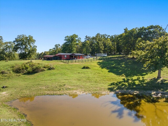 exterior space with a water view and a rural view