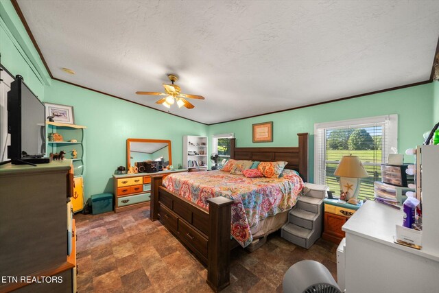 bedroom featuring crown molding, ceiling fan, vaulted ceiling, and a textured ceiling