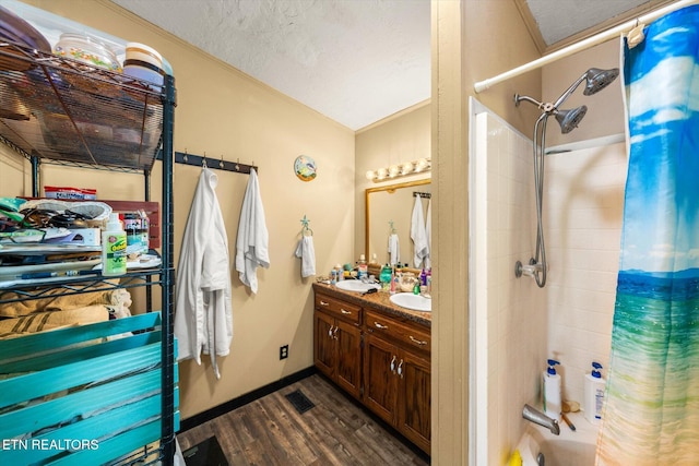 bathroom with vanity, hardwood / wood-style floors, and a textured ceiling