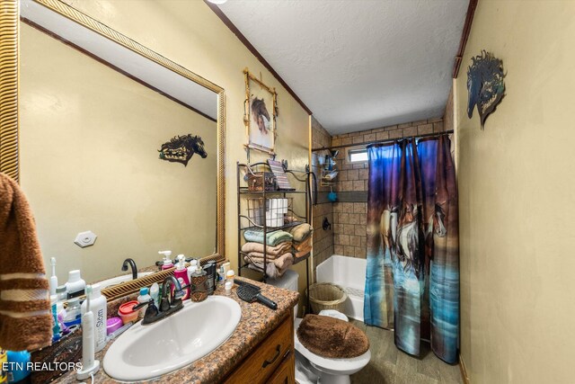 full bathroom featuring shower / bath combination with curtain, vanity, a textured ceiling, and toilet