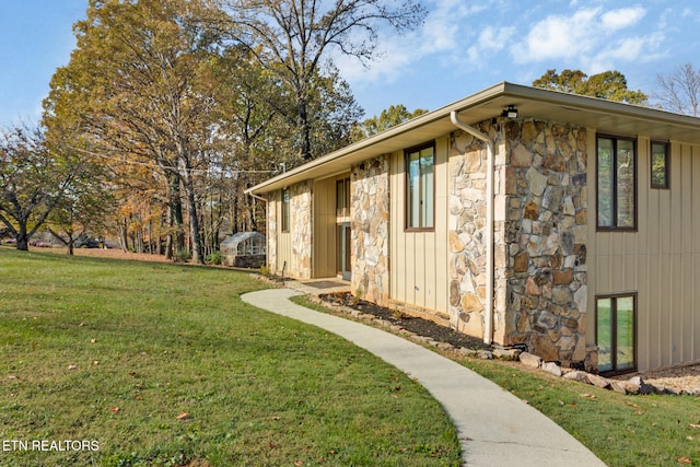 view of side of property featuring a yard