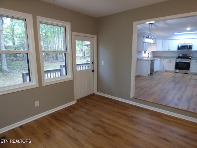 doorway featuring dark hardwood / wood-style flooring