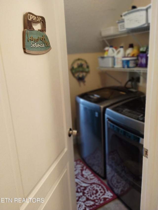 laundry room with washer and clothes dryer