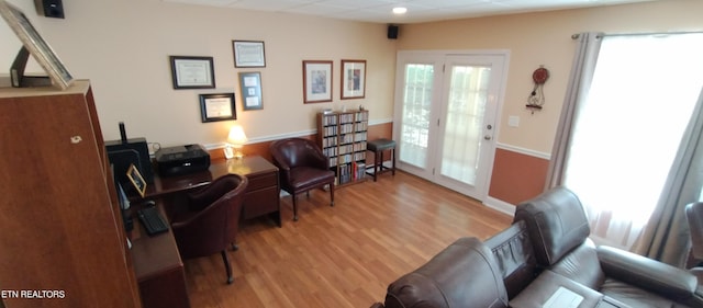 living area with light hardwood / wood-style flooring