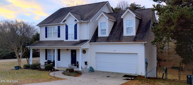 view of front of home featuring a garage and covered porch