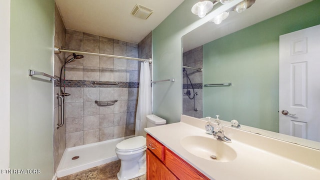 bathroom with a shower with curtain, vanity, and toilet