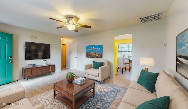 living room with ceiling fan