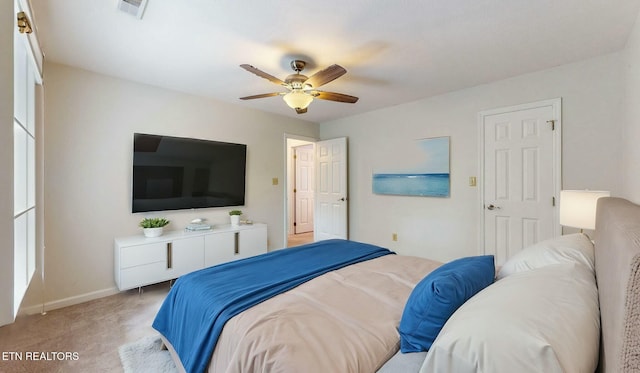 bedroom featuring ceiling fan and light carpet