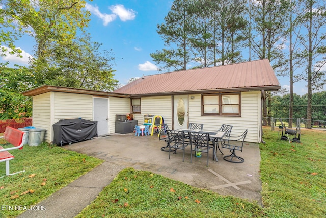 view of patio featuring a grill