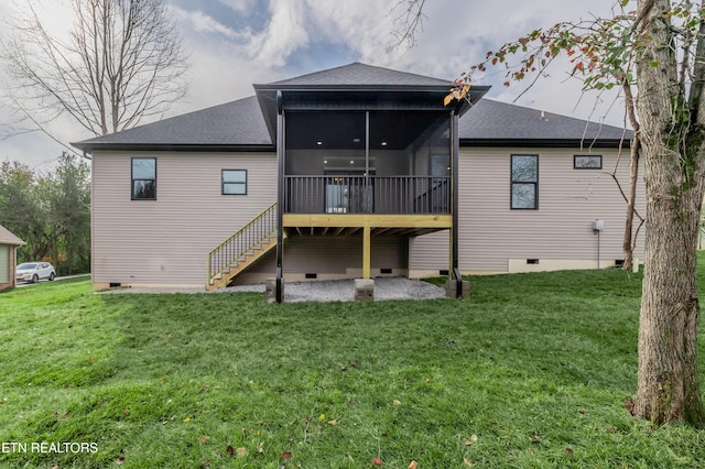 rear view of property featuring a patio area, a sunroom, and a yard