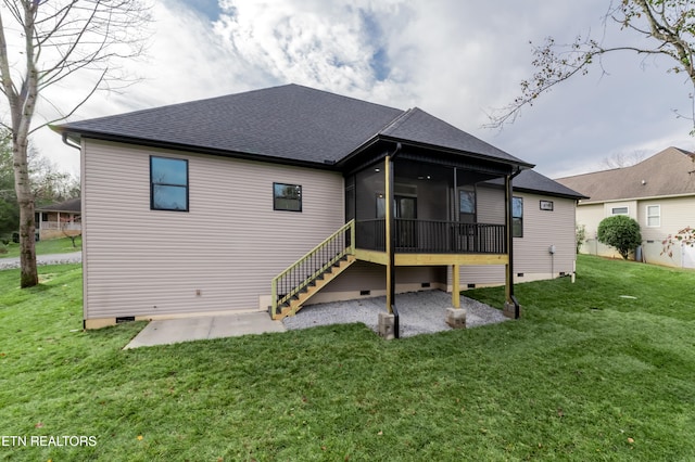 rear view of property with a sunroom, a yard, and a patio