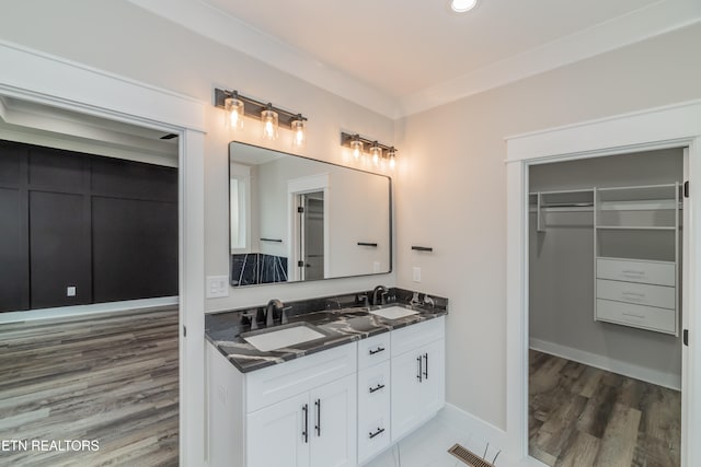 bathroom featuring hardwood / wood-style flooring and vanity