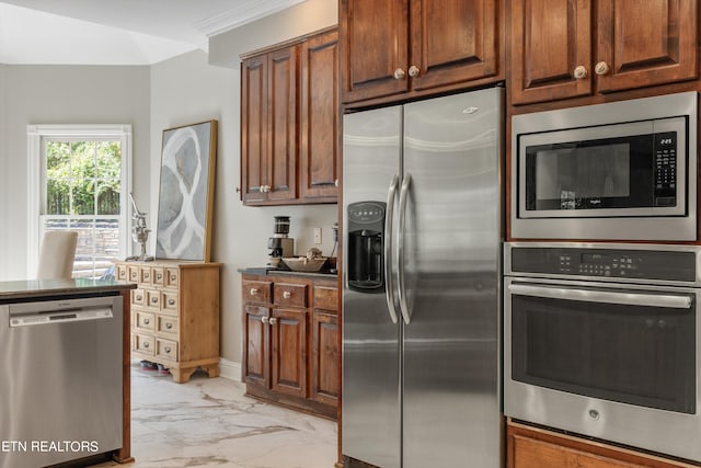 kitchen with stainless steel appliances and crown molding