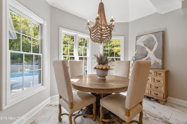 dining area featuring a notable chandelier