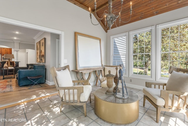 sunroom / solarium with an inviting chandelier, wood ceiling, lofted ceiling, and a wealth of natural light