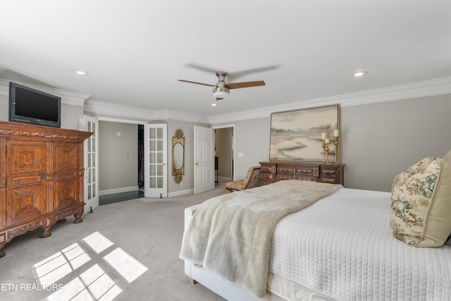 carpeted bedroom featuring ornamental molding, ceiling fan, and french doors