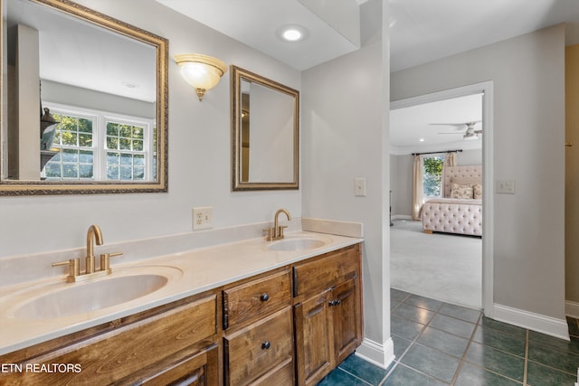 bathroom with a wealth of natural light, tile patterned flooring, and vanity