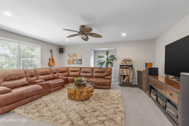 living room featuring ceiling fan and light carpet