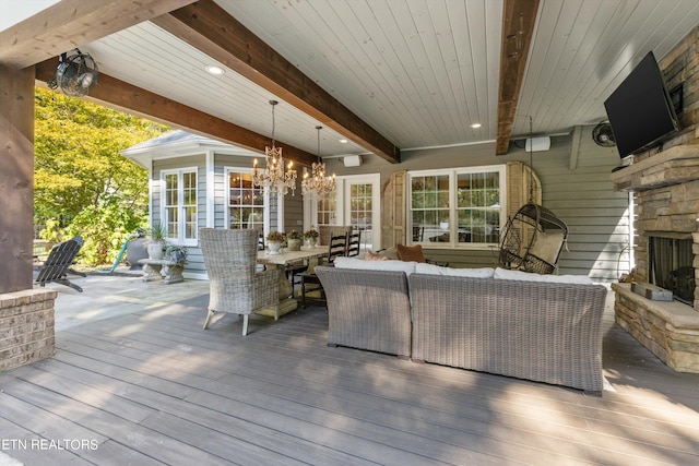 wooden deck featuring an outdoor living space with a fireplace