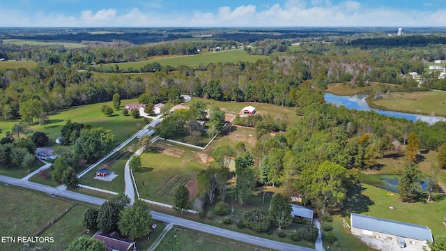 birds eye view of property with a water view and a rural view