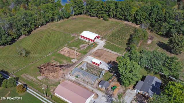 birds eye view of property featuring a rural view