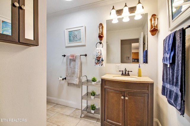 bathroom featuring vanity, ornamental molding, and tile patterned floors