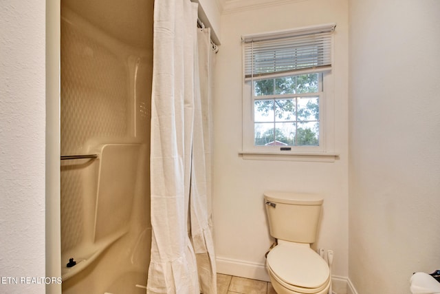 bathroom with toilet, a shower with shower curtain, and tile patterned floors