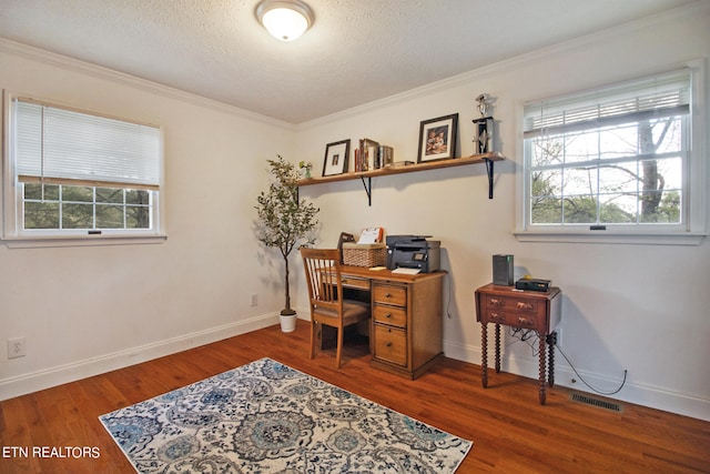 home office featuring a textured ceiling, crown molding, and dark wood-type flooring