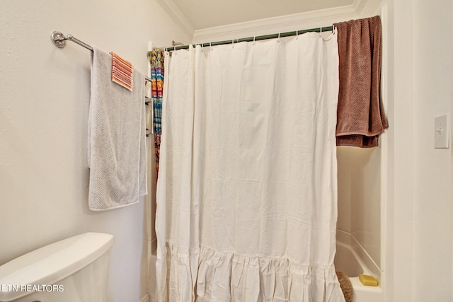 bathroom with ornamental molding, shower / tub combo with curtain, and toilet