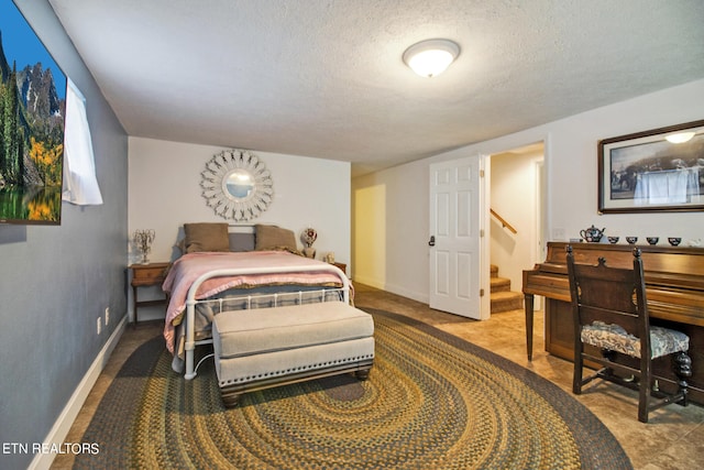 bedroom featuring a textured ceiling