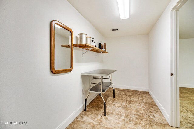 interior space with light tile patterned floors