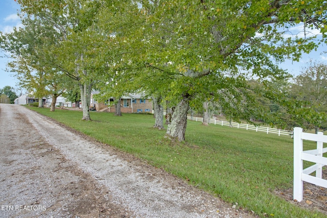 view of yard with a rural view